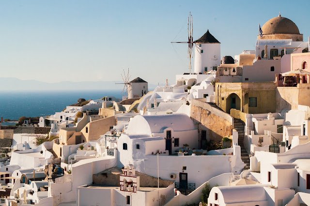 The iconic white architecture and windmills of Santorini, the volcanic island famous for its Vinsanto sweet wine.