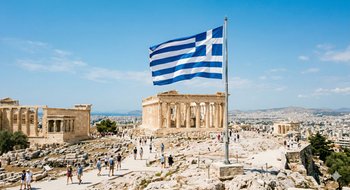 Greek flag waving at the Acropolis Parthenon safety 2026 vacation