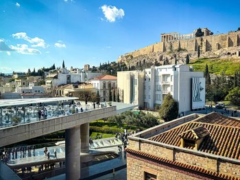 Stunning view from the Acropolis Museum cafe terrace overlooking the ancient Parthenon in Athens.