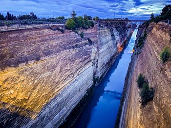 Stunning aerial view of the Corinth Canal with bright blue water, an essential stop for an Athens day trip.