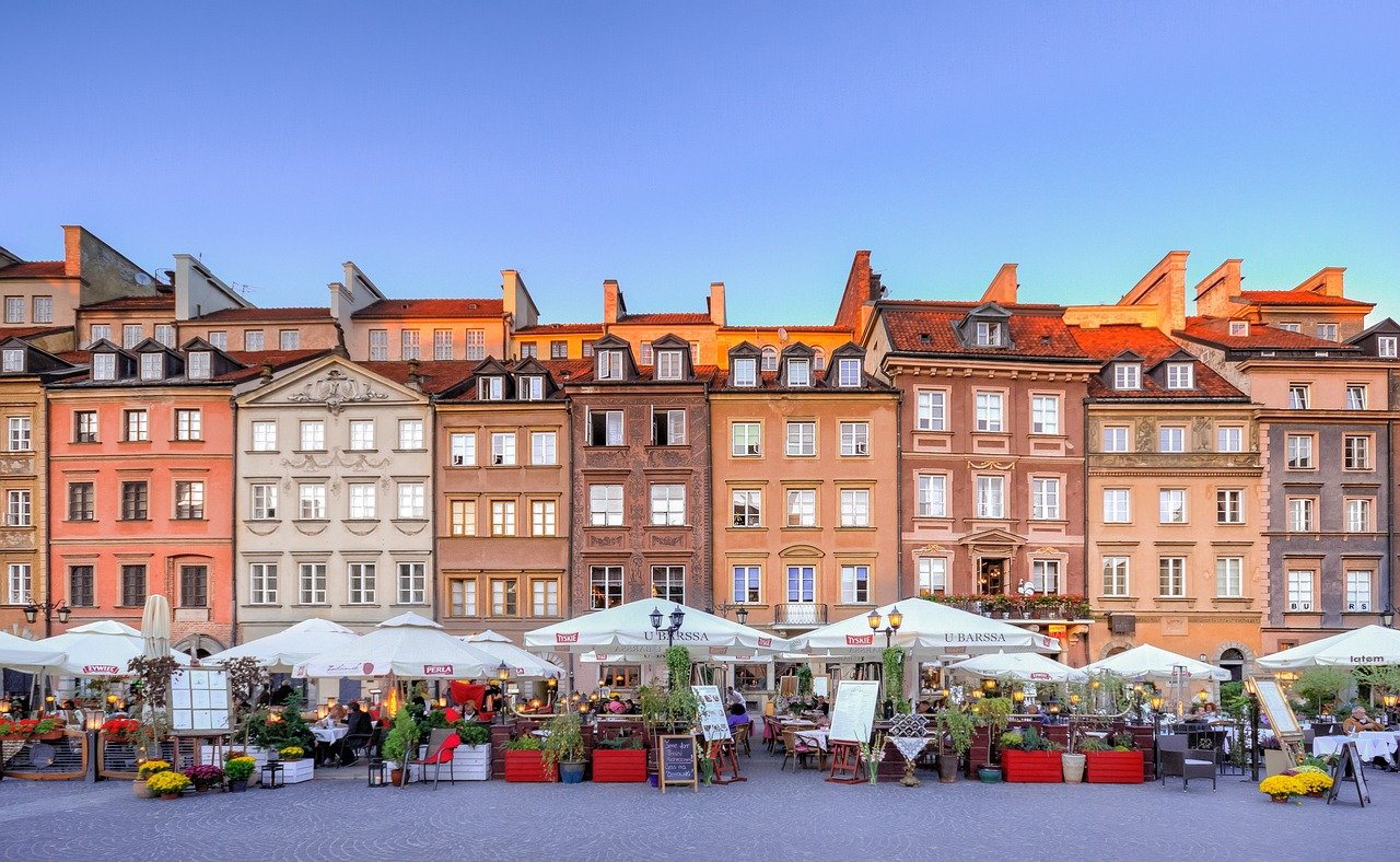 Historic Old Town Market Square in Warsaw, a popular destination accessible from Chopin Airport via various transport methods.